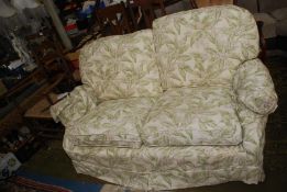 A very clean two seater Settee having Sanderson type loose cover,