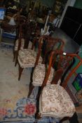 A set of four Mahogany framed Edwardian Dining Chairs having delicately fretworked splats,