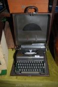 A brown cased Imperial typewriter in case, a/f.