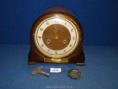 A wooden cased Smiths Enfield Mantle clock with Arabic numerals,