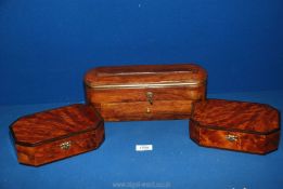 Two octagonal walnut finished jewellery Boxes, 8" x 5 1/2" x 2 1/2", plus oval box including key,