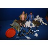 Two Action Man dolls with clothing, knitted cardigan, army jacket, guns, boots, snow shoes, etc.