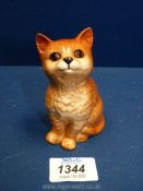 A Royal Doulton seated ginger cat with orange eyes 4" tall.