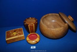 Four pieces of Treen including large covered bowl, inlaid musical box etc.