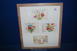 Four vintage floral wallpaper designs in a single limed oak frame, 16 1/2'' x 18 1/2''.