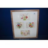 Four vintage floral wallpaper designs in a single limed oak frame, 16 1/2'' x 18 1/2''.