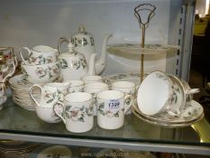 A Crown Staffordshire coffee set in 'Wild Rose' pattern including six coffee cans and saucers,