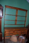A circa 1900 light Oak Welsh Dresser having five banded short drawers with glass knob handles,