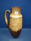 A large West German jug in beige and brown mottle, no: 426-47, 18 1/2" tall.