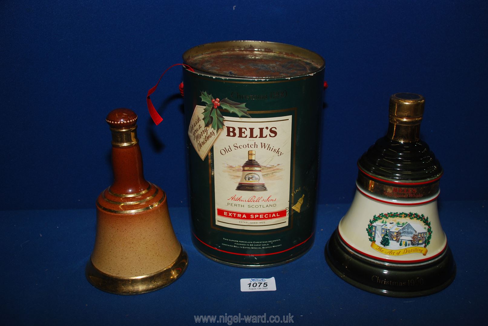 A Christmas 1990 Bells's Old Scotch whisky in tin (sealed and full) along with a Royal Doulton