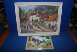 A large framed Tapestry of a village scene with country houses,