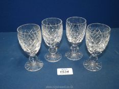 Four Waterford crystal port glasses.