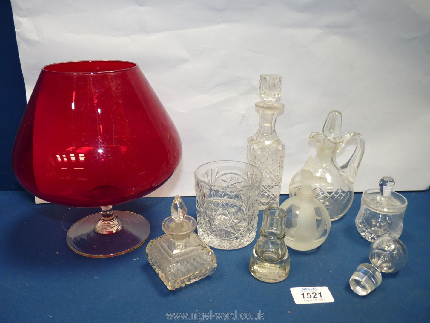 A quantity of glass including two small glass perfume bottles, ruby red goblet vase,