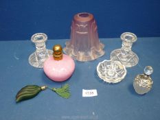 Three perfume bottles, a part dressing table set including candlesticks and ring dish,