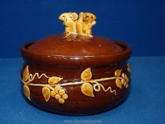 A David Cleverly Studio pottery lidded dish with foliage decoration to base and two mice to the lid,