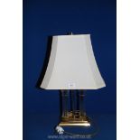 A glass and brass double Lamp and large cream lamp shade, 24" tall.