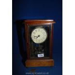 A Mahogany and glass anniversary Clock having cream face decorated with garlands and Arabic