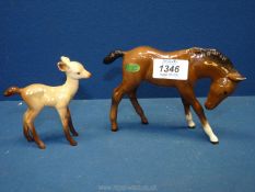 A Beswick foal 4¼" tall with its original sticker plus a smaller Beswick fawn in pale brown with