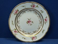 A Swansea or Nantgarw porcelain plate, white ground with gold borders to the rim,