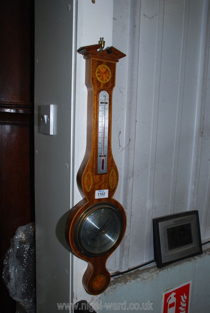 A contemporary Barometer and thermometer with marquetry shell decoration, 26'' long.