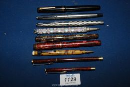 A quantity of assorted ballpoint Pens and three Parker 14ct ribbed fountain pens.