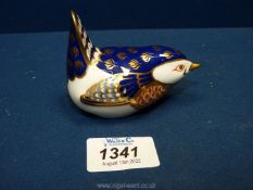 A Royal Crown Derby wren paperweight with blue, orange, and gold feathered coat,