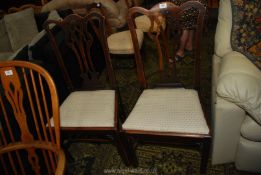 A pair of Georgian Oak framed side Chairs having fretworked splats and drop-in cream lattice