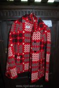A Welsh woolen Cape in red and black, size M, with matching belt.