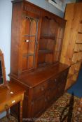 An old Charm/Priory Oak style contemporary Dresser having a flight of central shelves flanked by