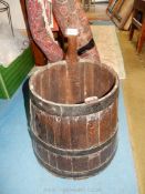 An antique dark Oak well Bucket of coopered construction having steel banding and broader at the