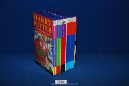 A Harry Potter box set of books 1 - 4 published 1997, 1998, 1999 and 2000.