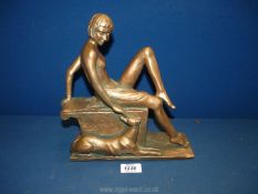 A Paul Jenkins art deco style Lady and her dog, 8 1/2'' long x 10 1/4'' high.