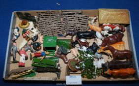 A quantity of old Britains metal farm animals including cattle, pigs, horses, etc,