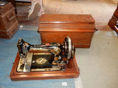A Singer sewing machine in wooden case, serial no.