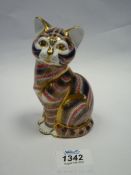 A Royal Crown Derby paperweight in the form of a seated cat in Imari style colours and pattern,