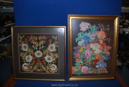 Two large framed floral tapestries on brown ground, one having colourful bouquet in vase,