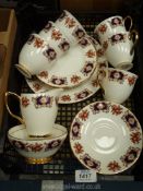 A Royal Imperial tea set for six with panels of blue, red and gold with sprays of flowers,
