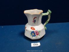 A Dillwyn Swansea pottery jug of octagonal form colourfully decorated with stylised flowers and