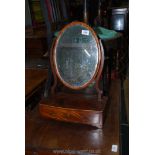 A small Victorian oval Mahogany veneered swing mirror with curved drawer to base, 21'' tall.