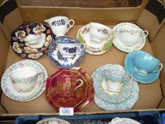 A quantity of china trios including Wedgwood, Minton, Royal Albert, etc, and cups and saucers.