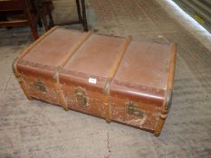 A Travel trunk with integral tray and luggage labels, 33" x 20" x 13".