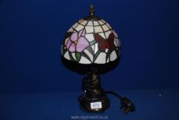 A Tiffany style table lamp and shade, 14" tall.