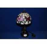 A Tiffany style table lamp and shade, 14" tall.