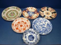 A small quantity of oriental plates and bowls including Cantonese, Imari, blue and white etc.