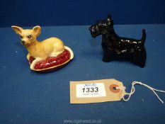 Two Beswick dogs including cream Chihuahua lay on a red cushion 2¾" tall and a black scottie dog 3"