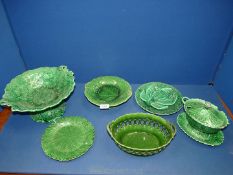 A box of green majolica leaf items including cake plate, serving dish, plates, etc, some badly a/f.