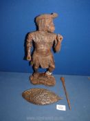 A hand carved ironwood figure of a Zulu warrior, carved from one tree branch, with spear and shield,
