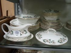 A Crown Staffordshire part dinner set in 'Wild Rose' pattern including six dinner plates,
