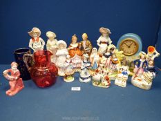 A quantity of figures including small Staffordshire flatbacks, German porcelain couple, spill vases,