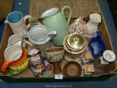 A quantity of miscellaneous china including jugs, a biscuit barrel, candlesticks, pottery items,